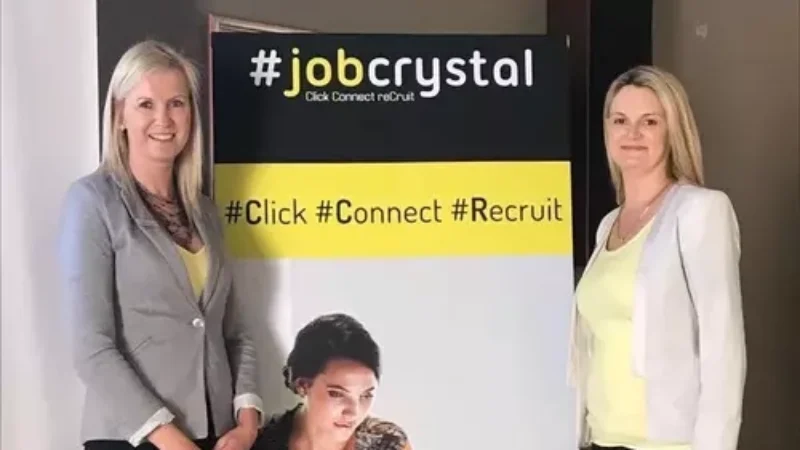 Two-women standing-near-job-crystal-poster